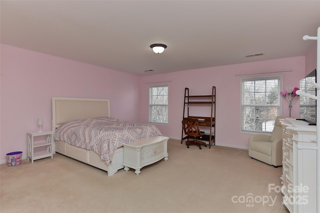 bedroom featuring light carpet