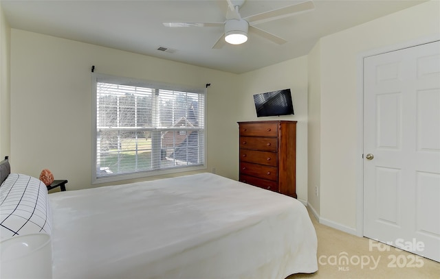 carpeted bedroom featuring ceiling fan