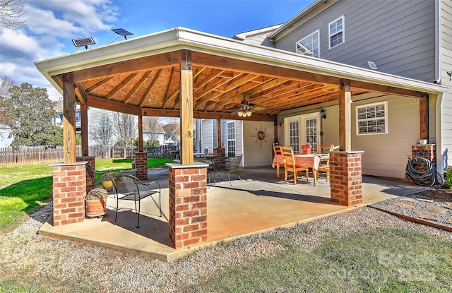 view of patio / terrace with a gazebo, ceiling fan, and french doors