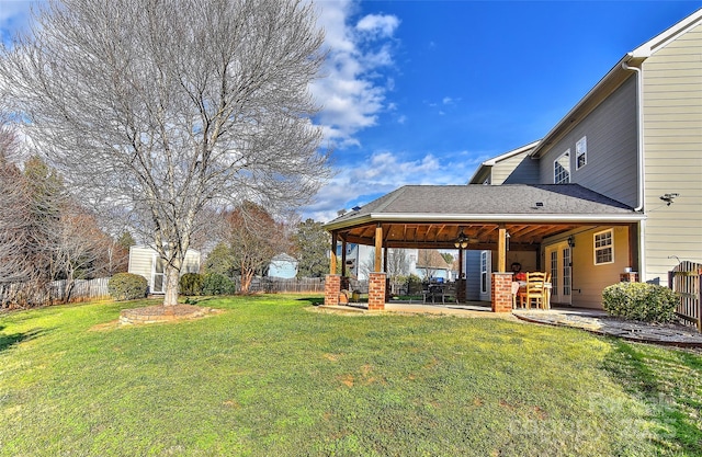 view of yard with a patio and ceiling fan