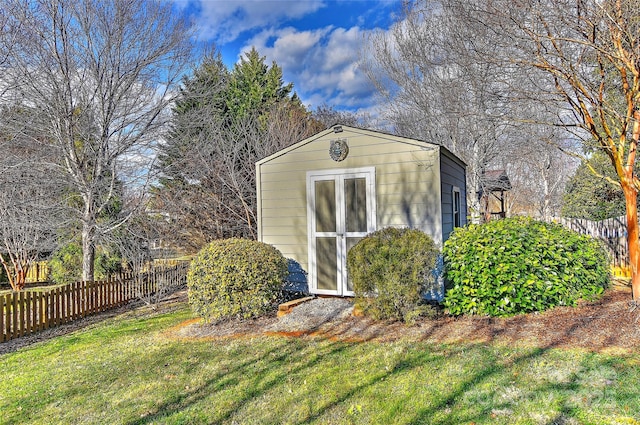 view of outbuilding with a lawn