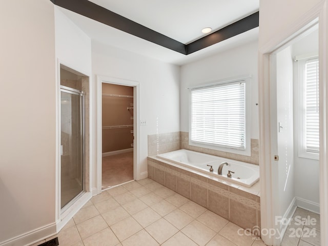 bathroom featuring tile patterned floors and separate shower and tub