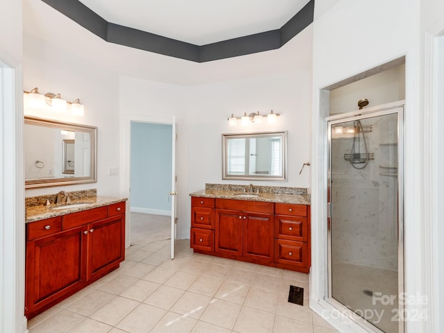 bathroom with vanity, tile patterned floors, and an enclosed shower