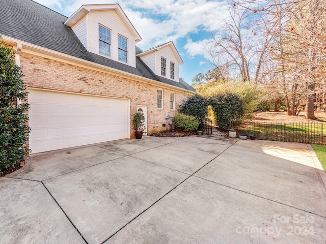 view of home's exterior with a garage