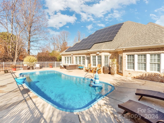 view of swimming pool with a patio area and french doors