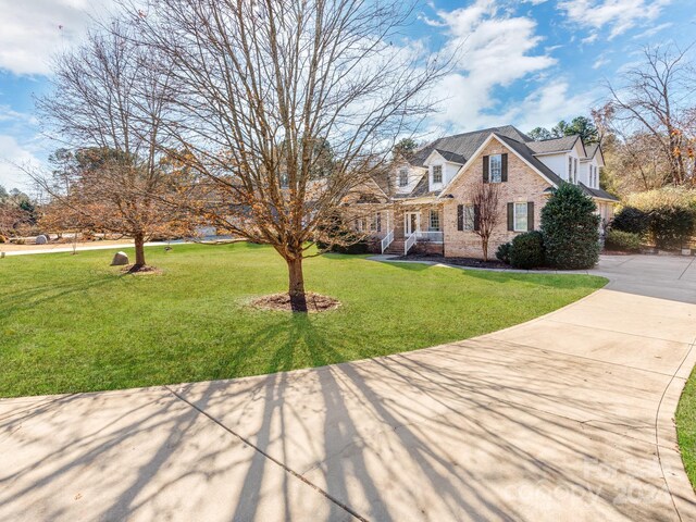 view of front of home with a front yard