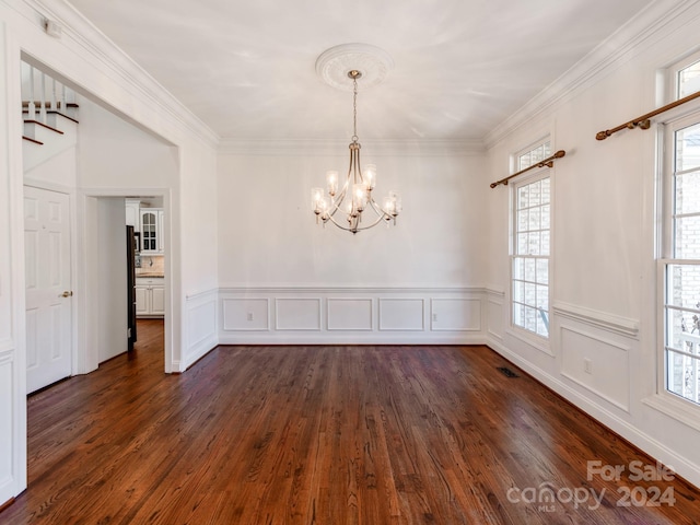 unfurnished room with dark hardwood / wood-style flooring, plenty of natural light, and ornamental molding