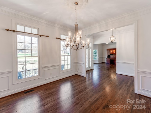 unfurnished dining area with crown molding and dark hardwood / wood-style flooring