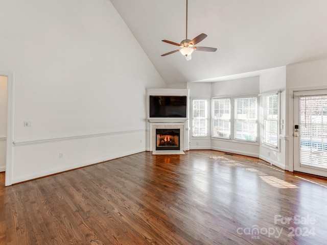 unfurnished living room featuring ceiling fan, hardwood / wood-style floors, and high vaulted ceiling