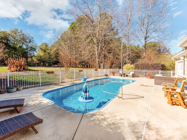 view of swimming pool with a patio area