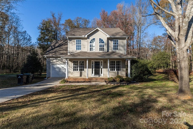 view of property featuring a front lawn, covered porch, and a garage