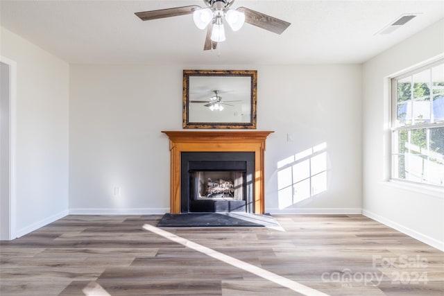 unfurnished living room featuring hardwood / wood-style flooring