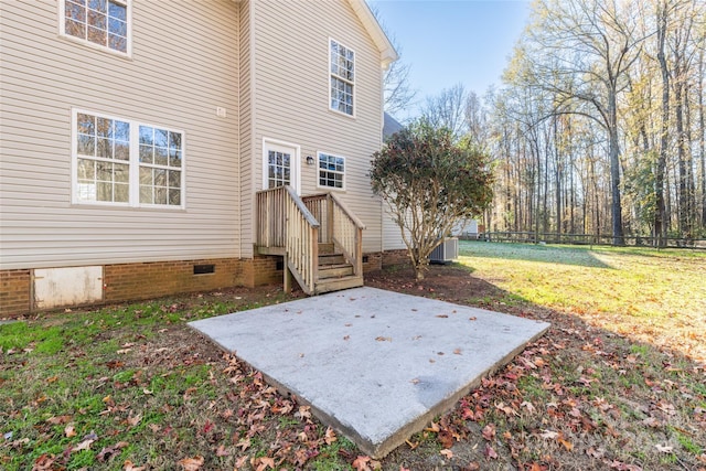 exterior space with a lawn and a patio