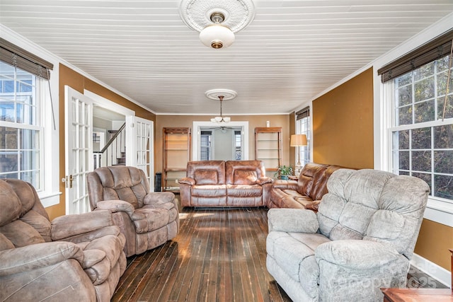 living room with wood-type flooring and crown molding