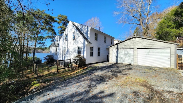 view of property exterior featuring an outbuilding and a garage