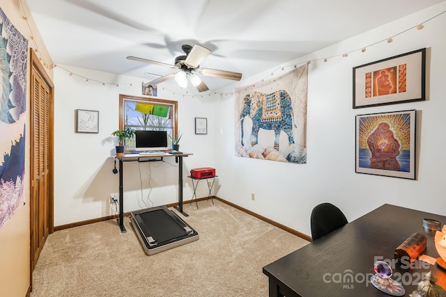 workout area with ceiling fan and carpet floors