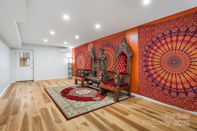 interior space featuring light hardwood / wood-style flooring and a wall mounted air conditioner