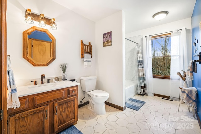 full bathroom featuring toilet, tile patterned flooring, shower / bath combo with shower curtain, and vanity