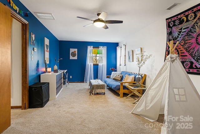 living room featuring carpet flooring and ceiling fan