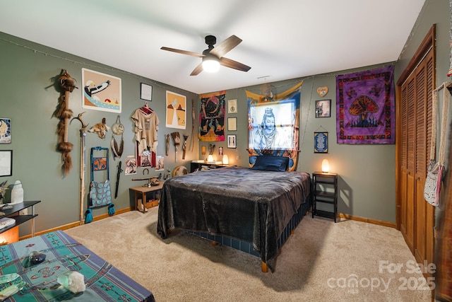 bedroom with a closet, ceiling fan, and carpet flooring