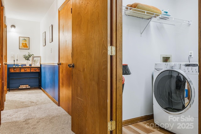 laundry room with washer / clothes dryer and light colored carpet