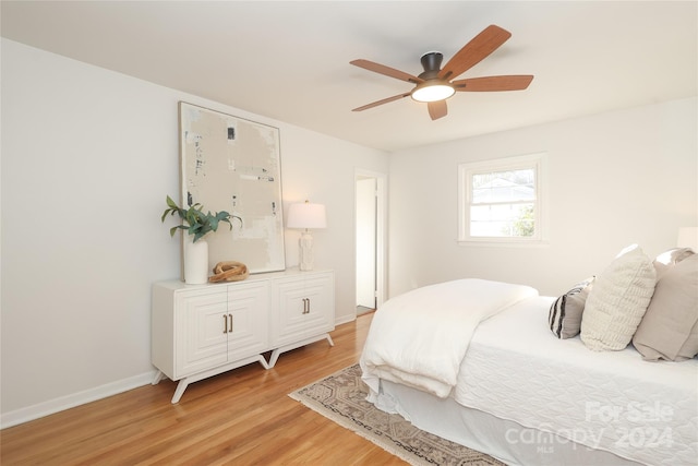 bedroom featuring light hardwood / wood-style floors and ceiling fan