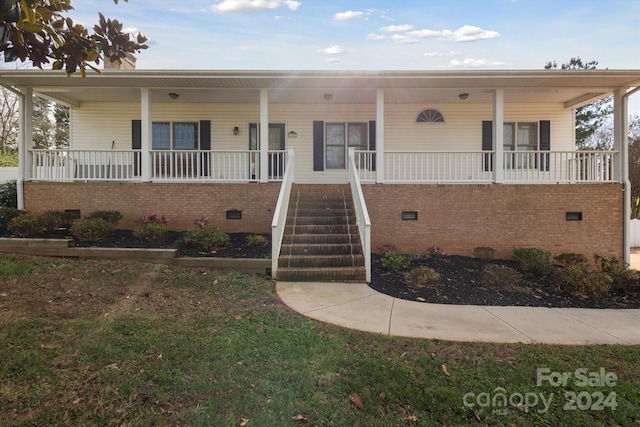 view of front of home featuring covered porch