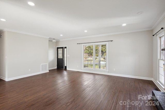 unfurnished room featuring crown molding and dark hardwood / wood-style flooring