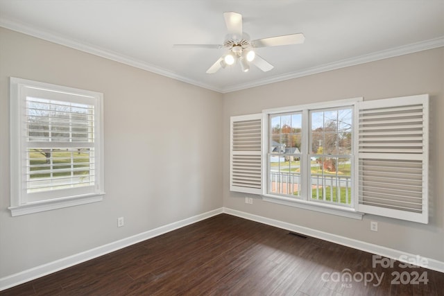 unfurnished room featuring dark hardwood / wood-style flooring, a healthy amount of sunlight, and ornamental molding