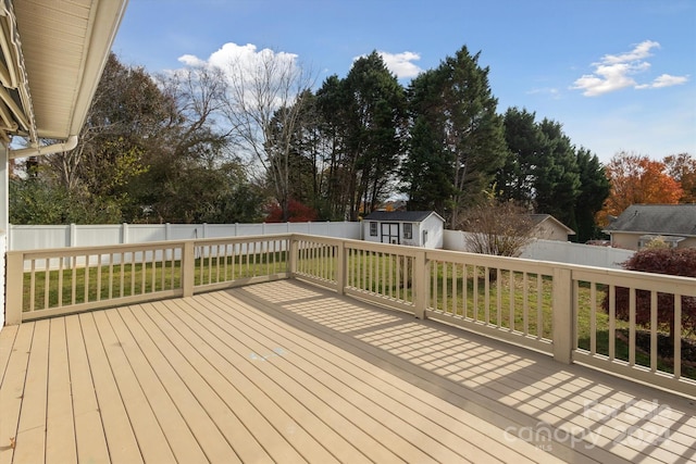 wooden deck featuring an outdoor structure