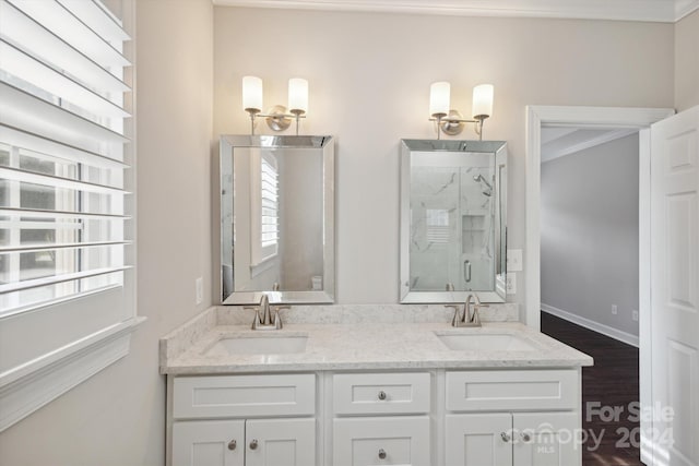 bathroom featuring plenty of natural light, wood-type flooring, crown molding, and walk in shower