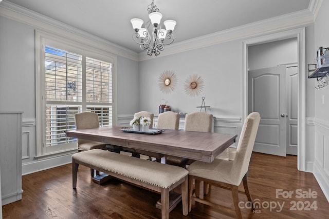 dining area with ornamental molding, dark hardwood / wood-style flooring, an inviting chandelier, and a healthy amount of sunlight