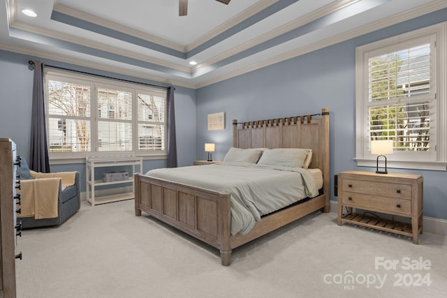 bedroom with ceiling fan, light colored carpet, and ornamental molding