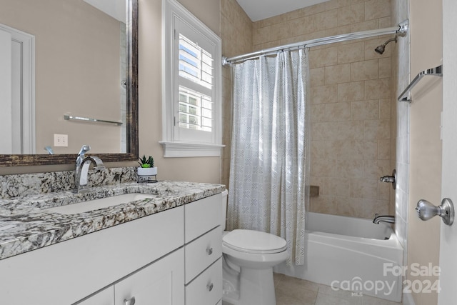 full bathroom with toilet, shower / tub combo with curtain, vanity, and tile patterned flooring