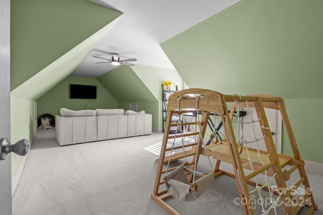 bedroom featuring carpet, ceiling fan, and vaulted ceiling