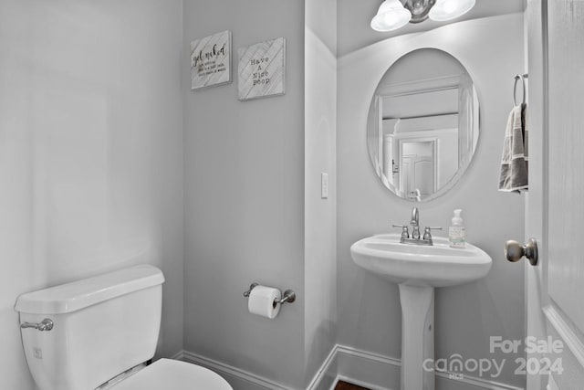 bathroom with sink and toilet