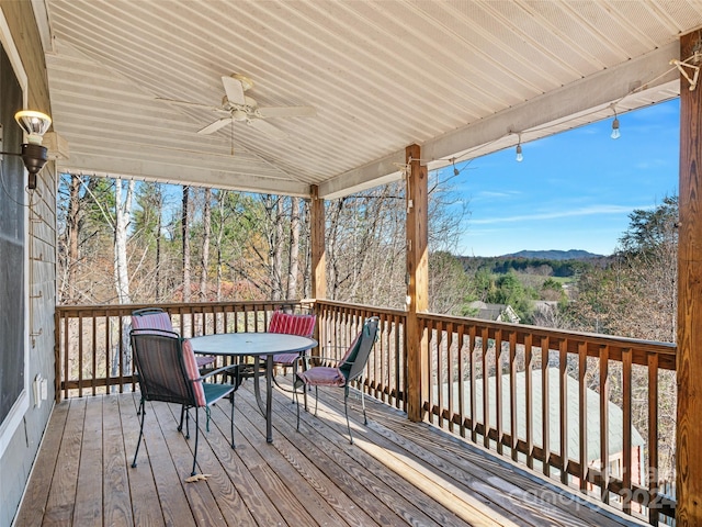 wooden terrace featuring ceiling fan