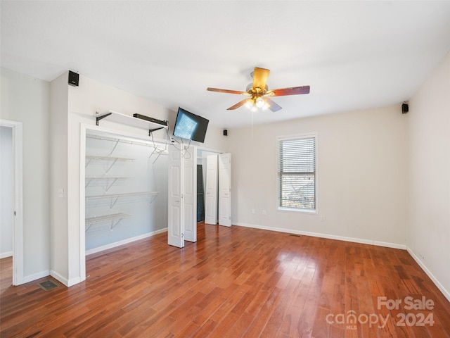 unfurnished bedroom with wood-type flooring and ceiling fan