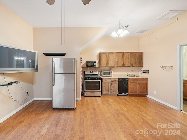 kitchen with ceiling fan with notable chandelier, sink, black appliances, light hardwood / wood-style flooring, and lofted ceiling