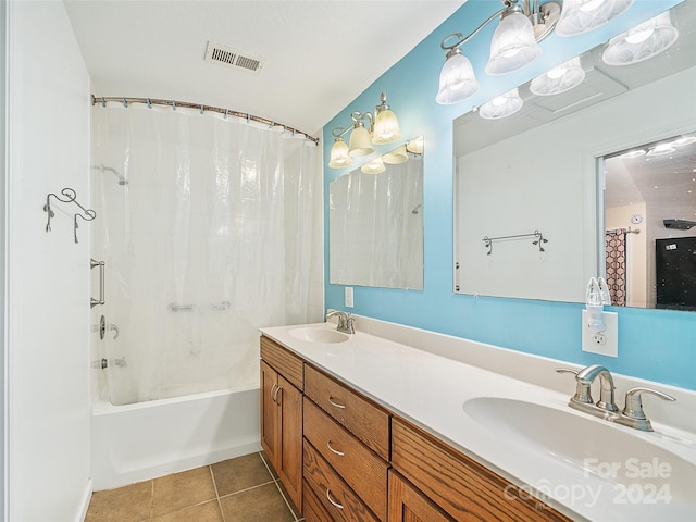 bathroom featuring shower / tub combo, vanity, and tile patterned floors