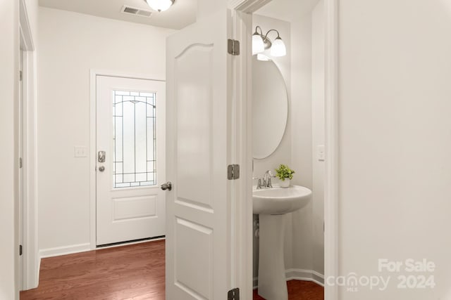 bathroom with wood-type flooring