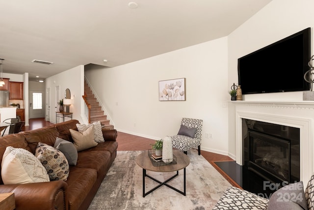 living room with dark hardwood / wood-style flooring