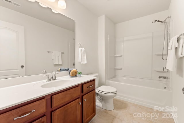 full bathroom featuring tile patterned flooring, vanity, toilet, and shower / washtub combination