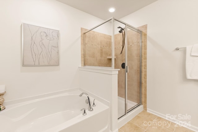 bathroom featuring separate shower and tub and tile patterned flooring