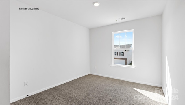 empty room featuring carpet floors