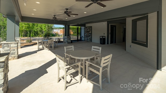 view of patio featuring ceiling fan