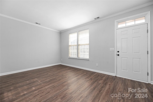 entryway with crown molding and dark wood-type flooring