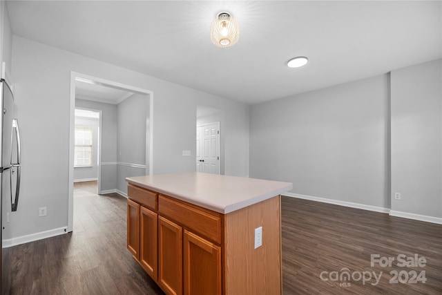 kitchen featuring dark hardwood / wood-style flooring and a kitchen island