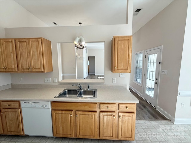 kitchen featuring light wood-type flooring, sink, pendant lighting, an inviting chandelier, and dishwasher