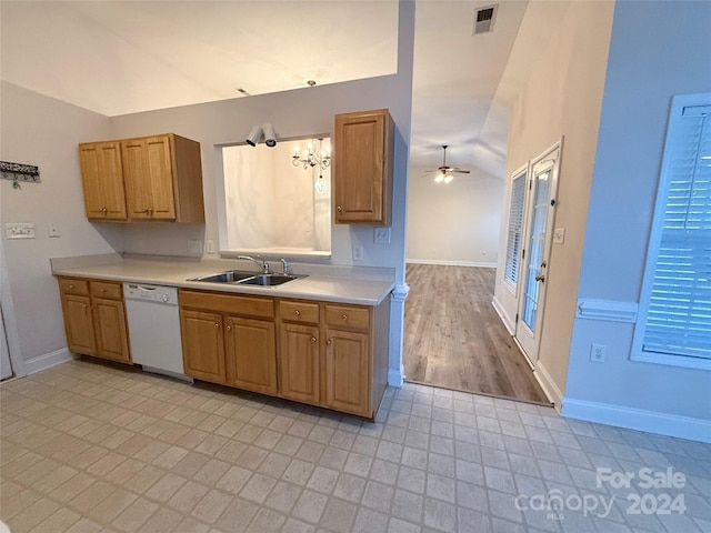 kitchen featuring ceiling fan, dishwasher, sink, light hardwood / wood-style flooring, and lofted ceiling